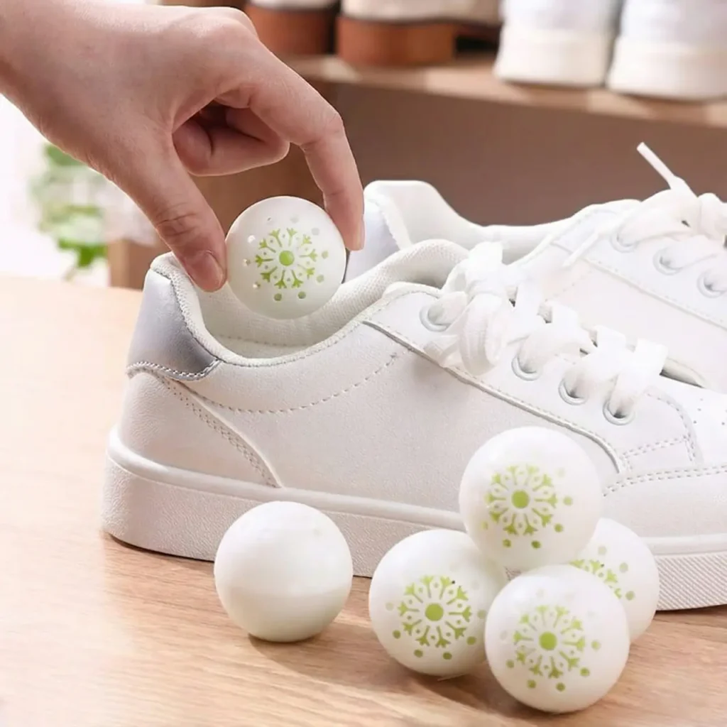 Shoe deodorizer balls shown as a practical Christmas gift for him at work.